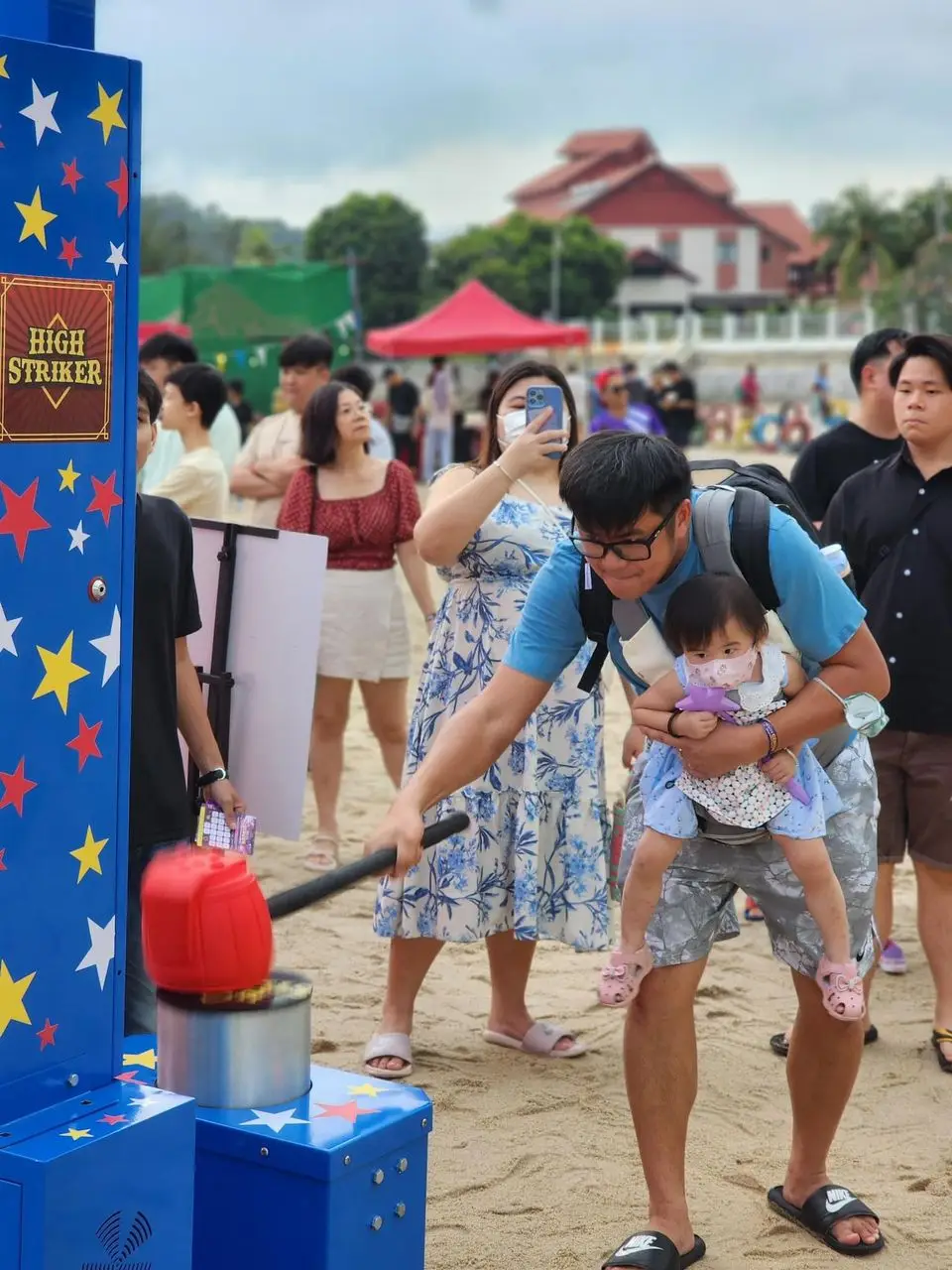 Hammer Machine Challenge - Participants take a swing with the hammer, testing their strength as they aim to reach the top of the meter. Ideal for showcasing might and friendly competition at events and parties.