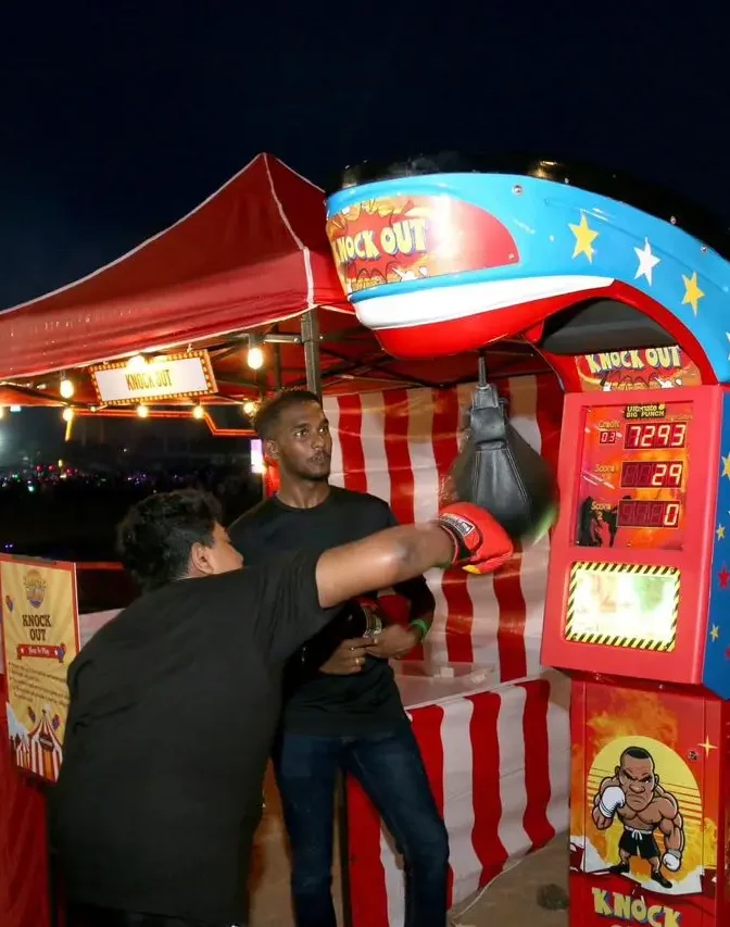 Boxing Machine - Participants test their strength and agility on a boxing machine, delivering powerful punches. Ideal for those seeking a physical challenge, this interactive attraction adds excitement to events and parties.