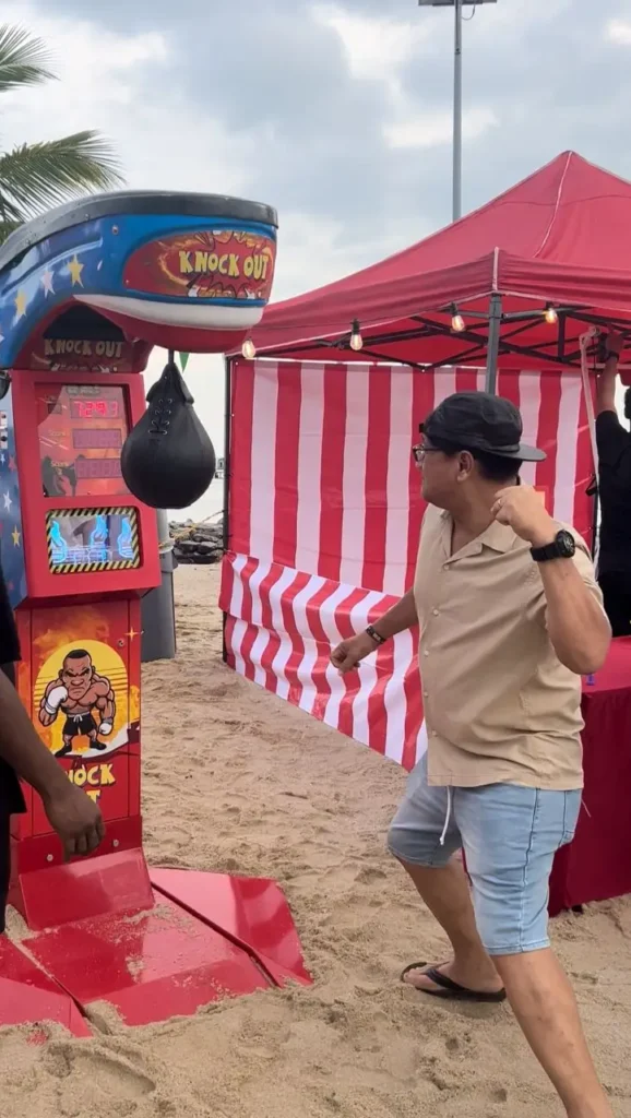Boxing Machine - Participants test their strength and agility on a boxing machine, delivering powerful punches. Ideal for those seeking a physical challenge, this interactive attraction adds excitement to events and parties.