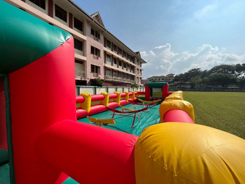 Human Foosball Challenge - Participants become the players in a life-sized foosball game, moving side to side and kicking the ball to score goals. Ideal for team players, this interactive game adds excitement to events and parties.